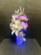Purple & White Floral Arrangement in Blue Glass Vase